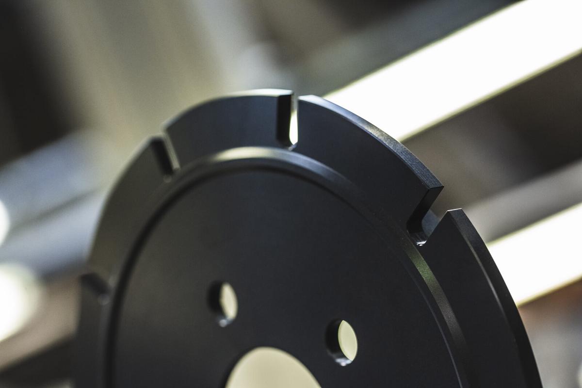 Automotive brake bell in 6082 alloy with OX-HS hard anodizing and sealing for corrosion resistance